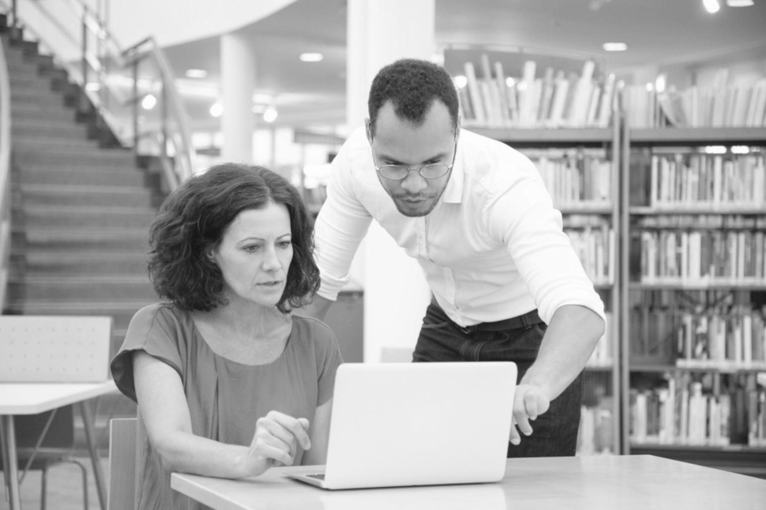 Professional presenting financial data to engaged team members